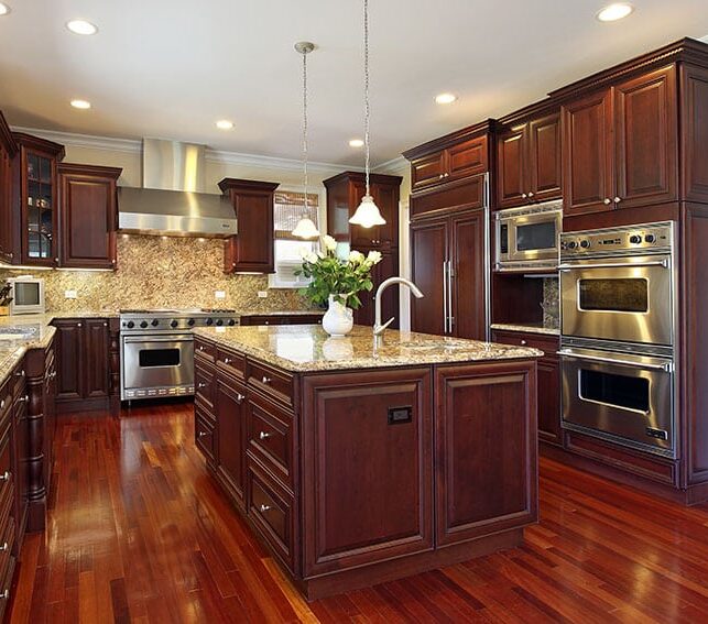 cherry-kitchen-with-granite-counters-and-stainless-steel-appliances